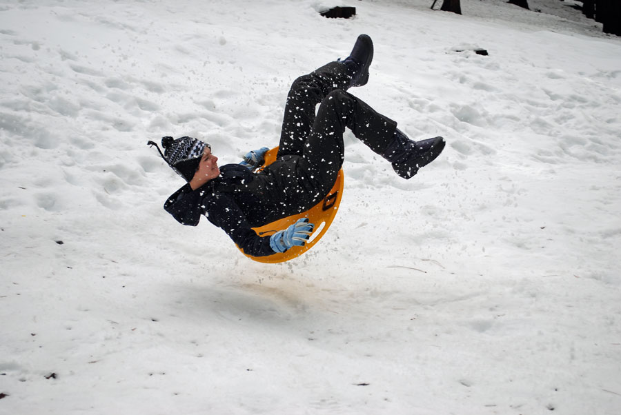 rider on snow saucer