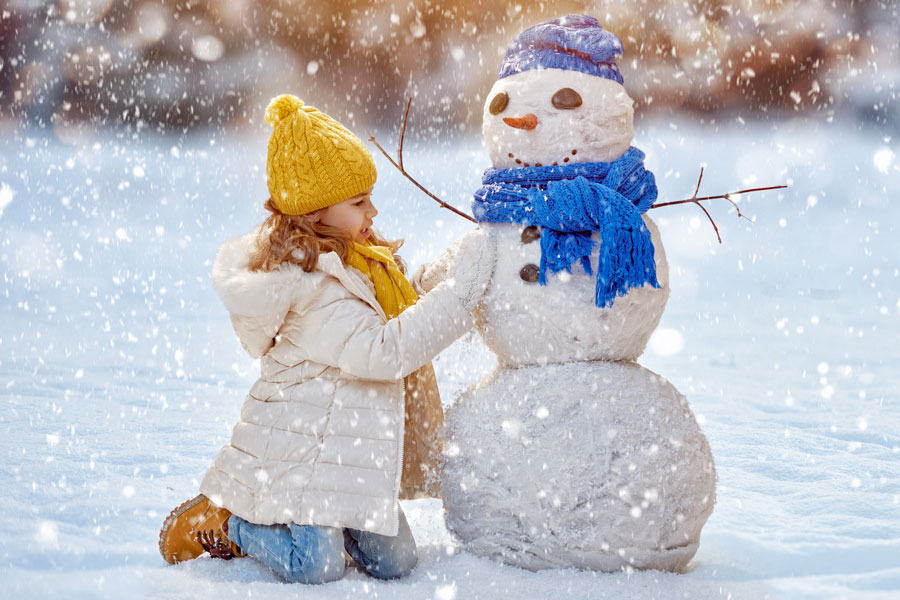 girl making snowman